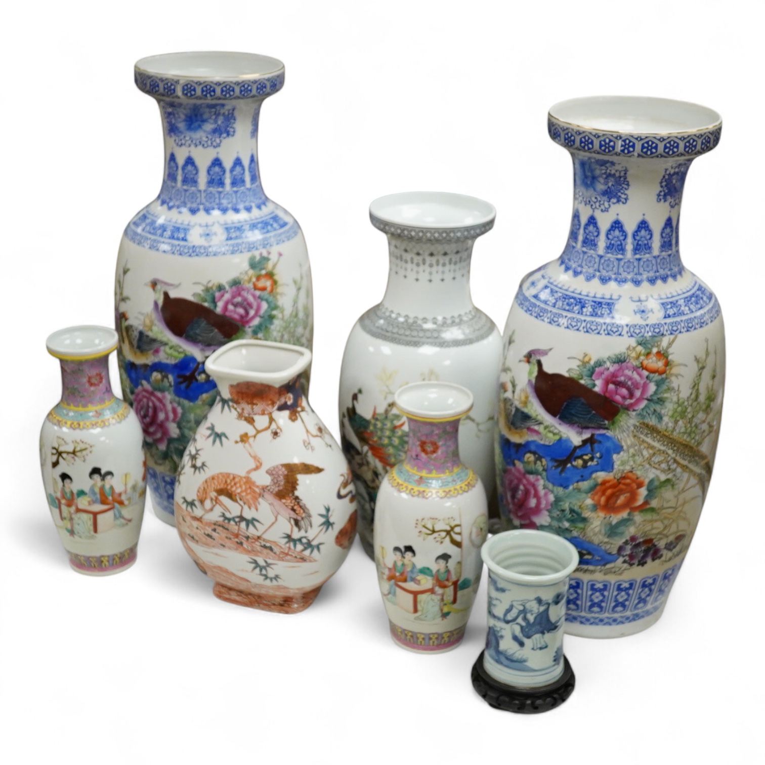 A large pair of Chinese polychrome vases, 60cm high, a pair of famille rose vases, a blue and white brushpot and two other vases (7).